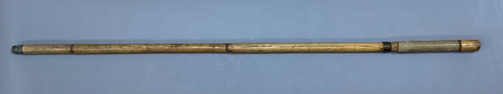 A 19th century bamboo swordstick, with vellum mounted handle and worn blued steel blade, overall length 89cm